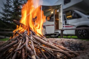 RV Travelers with a fire too close